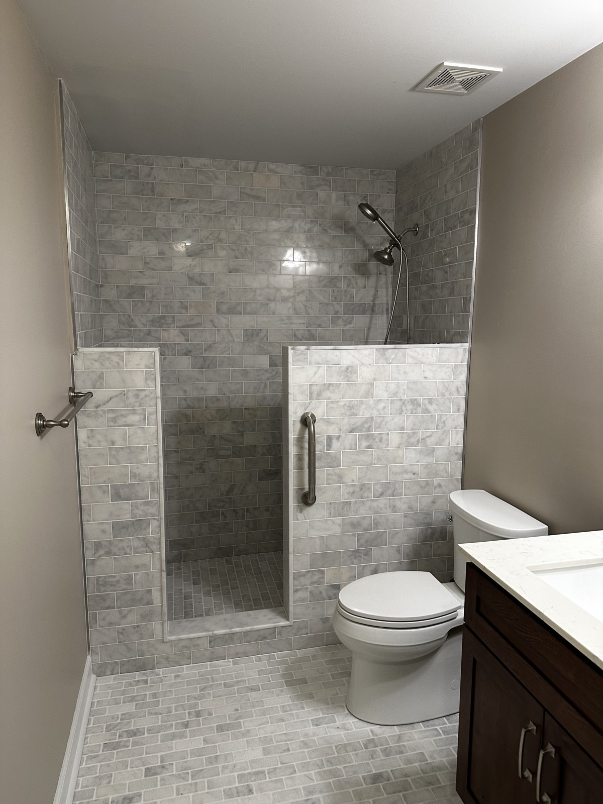 Marble subway-tile walk-in shower remodel